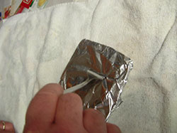 tin foil perforated to allow air to circulate